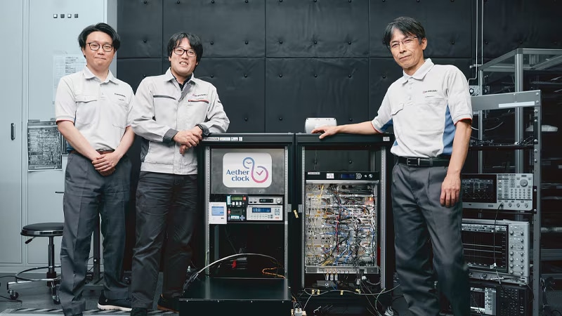 Project team at Technology Research Laboratory standing with the Aetherclock OC020 Optical Lattice Clock