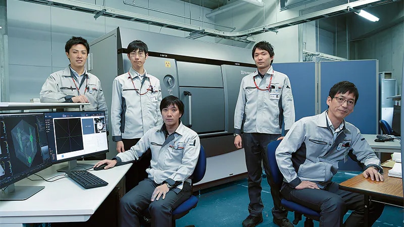 Members of the development team around the XDimensus 300