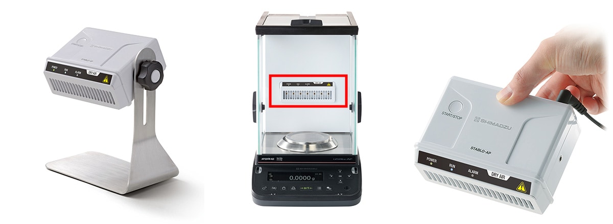 Product Photo: STABLO-AP DRY AIR Standing on its Dedicated Stand Product Photo: STABLO-AP DRY AIR, Built into the AP W-AD Series Analytical Balances Product Photo: STABLO-AP DRY AIR Held by an Operator