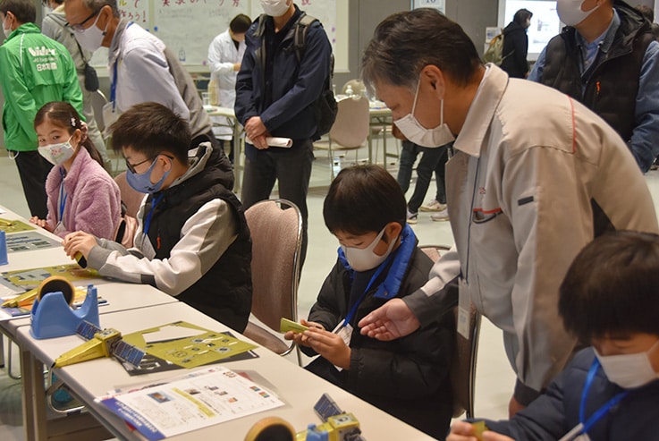 Shimadzu Booth with Crowds of Children