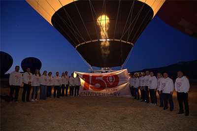 Gathering in Cappadocia, wearing sweatshirts decorated with the key commemorative visual of the 150th anniversary
