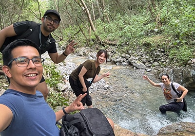 Tanaka (center) strengthening ties with distributor staff during a hiking trip on a day off