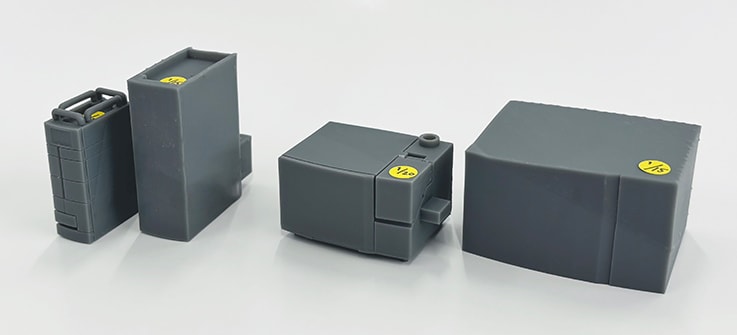 Prototype models of different scales. From left: Liquid chromatograph models at 1/20 and 1/15 scale, and inductively coupled plasma mass spectrometer models at 1/20 and 1/15 scale